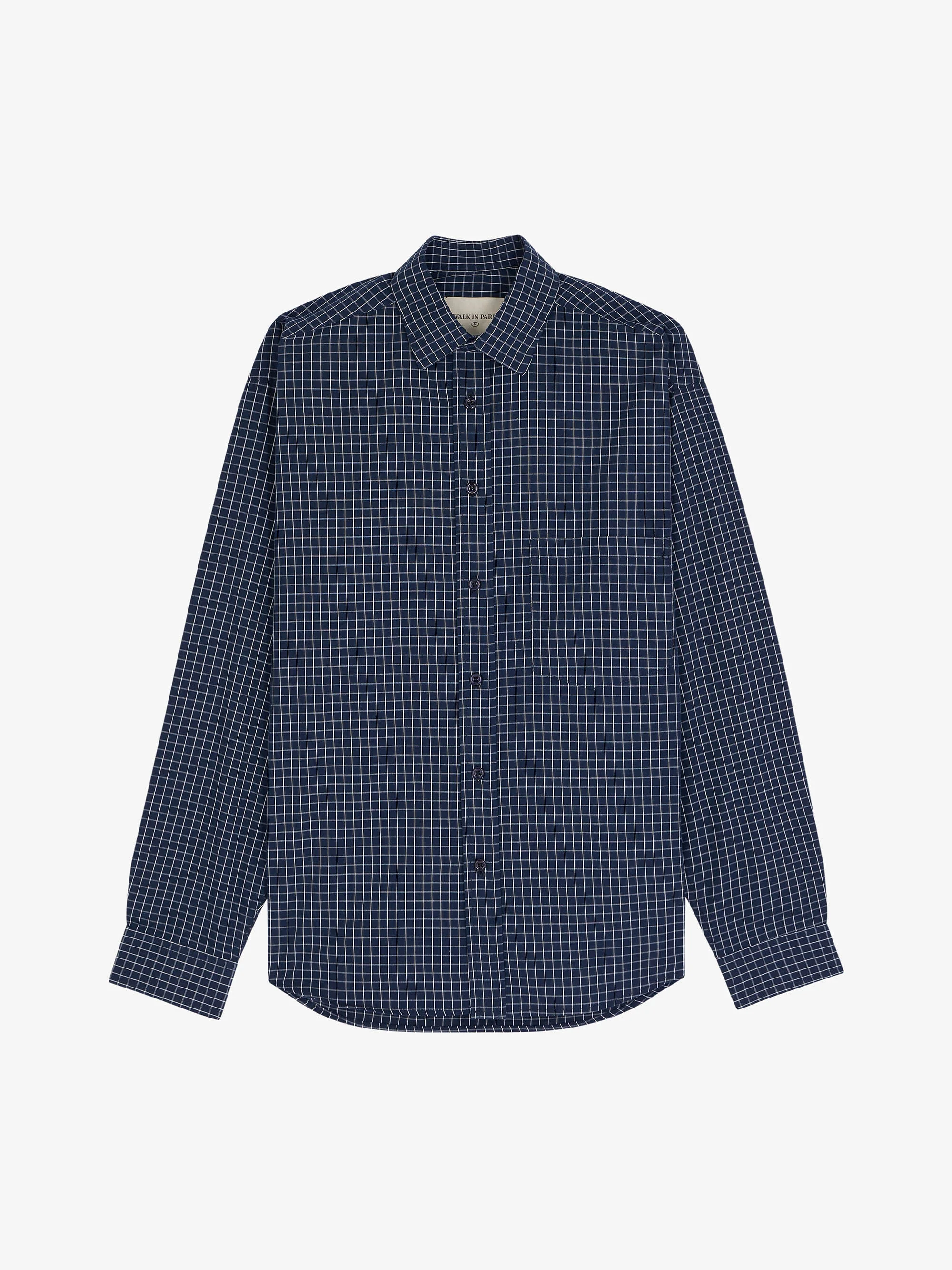 La chemise à carreaux bleue