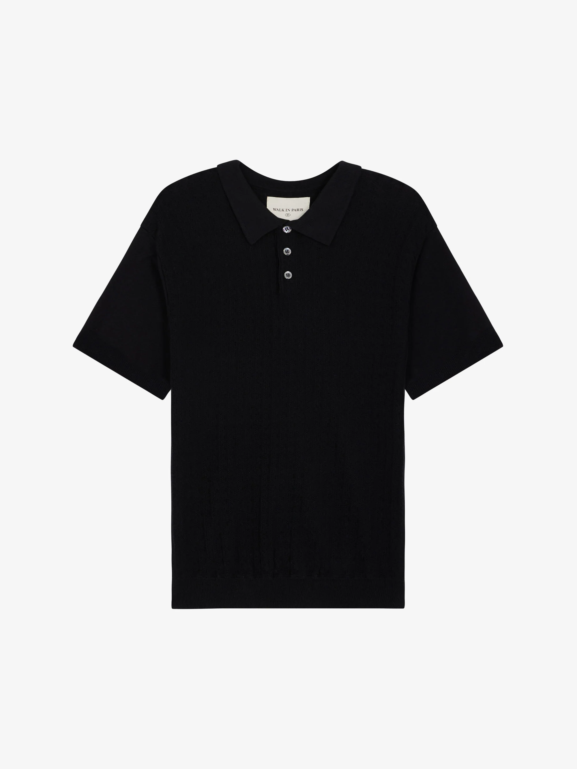 Le polo noir en maille torsadée